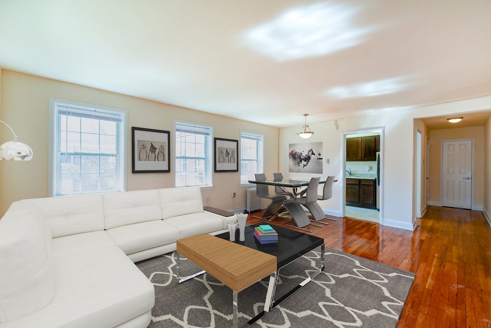 Sunlit living room with hardwood floors